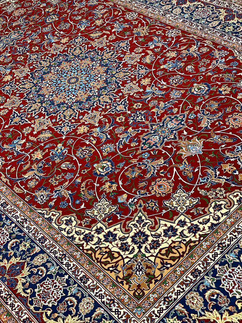 "Persian masterpiece rug with vibrant red field and detailed borders."